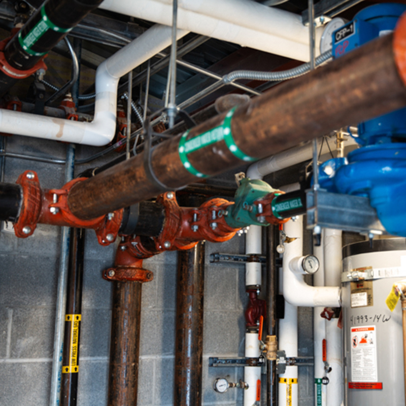 Commercial plumbing system with mechanical components and piping installed to support water, drainage, and building operations in a commercial facility.