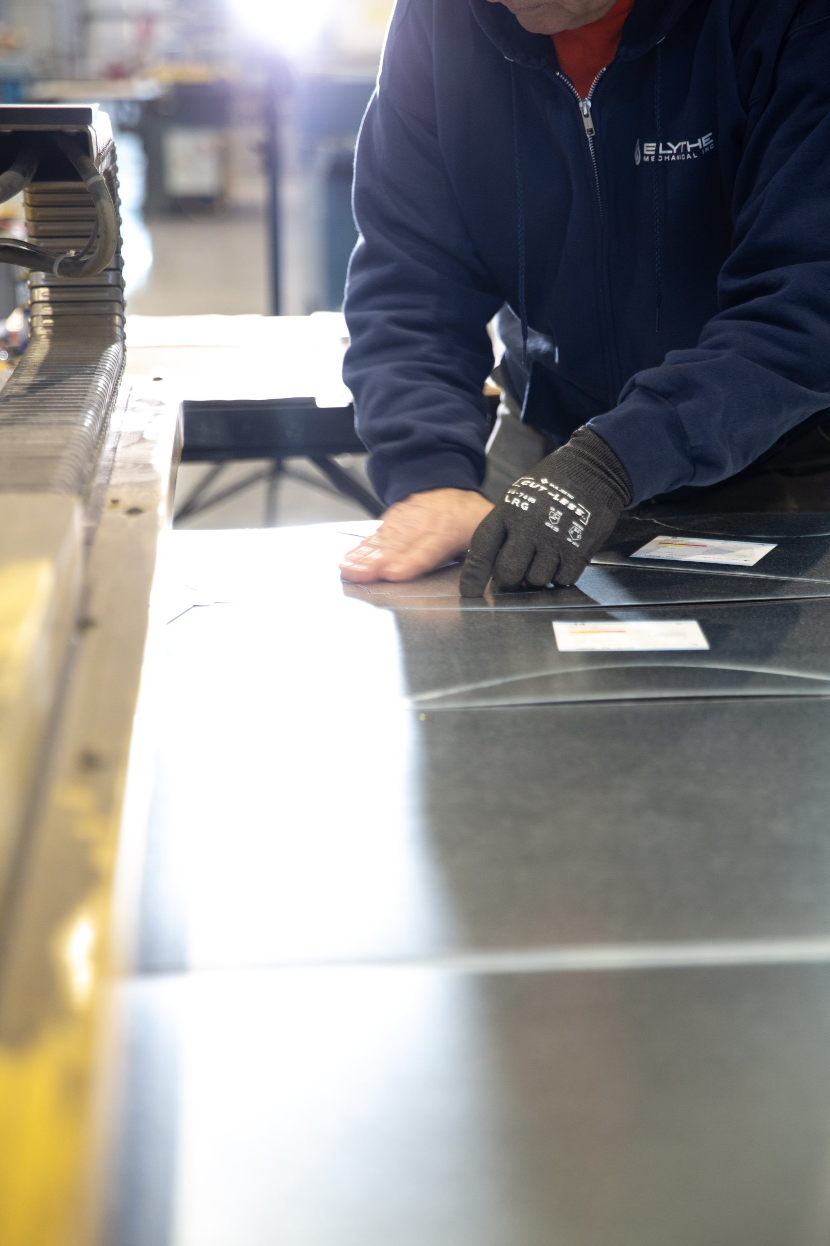 Blythe Mechanical technician working on commercial sheet metal fabrication for HVAC and mechanical system applications.