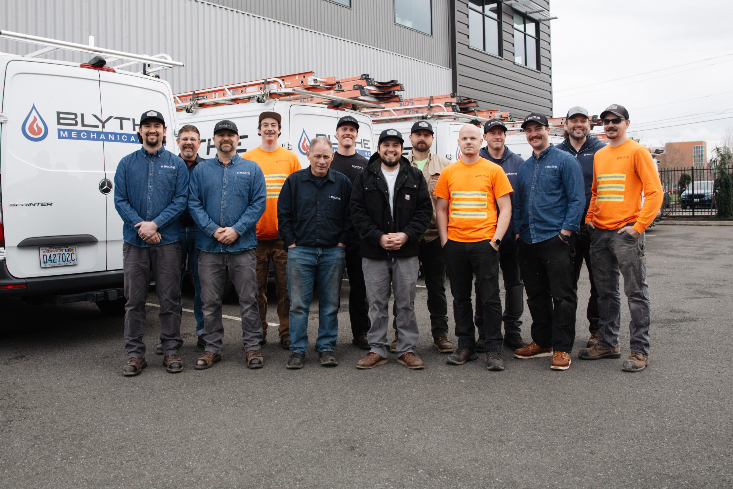 Blythe Mechanical team members standing together, representing careers in commercial HVAC, plumbing, and industrial refrigeration.
