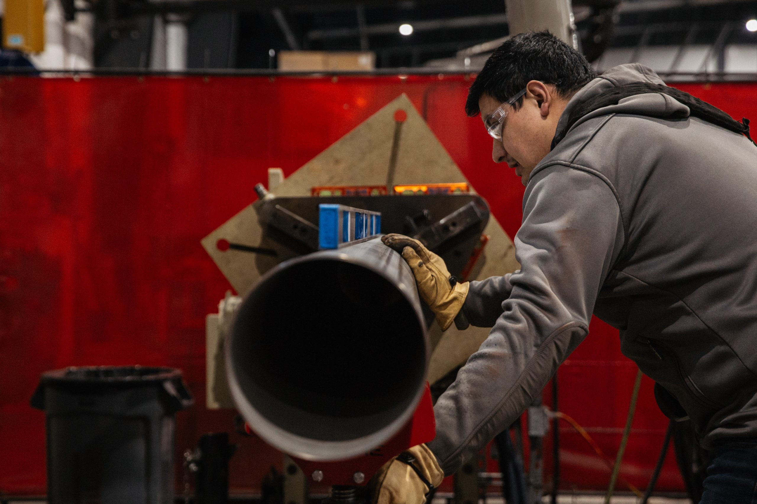 Blythe Mechanical technician performing preventative maintenance on commercial mechanical equipment at a customer facility.