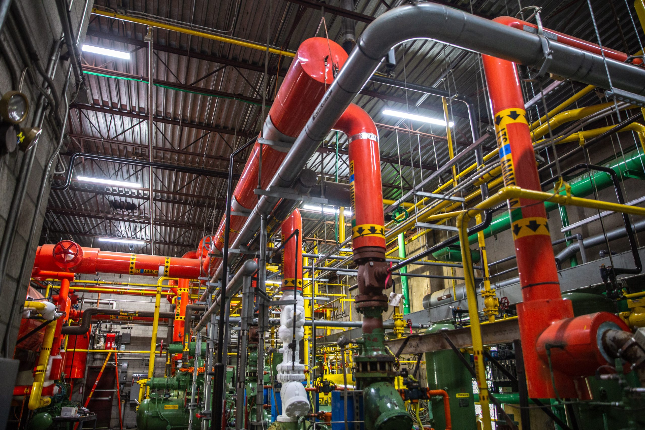 Large industrial refrigeration system with interconnected mechanical components used for commercial cooling and temperature-controlled operations.