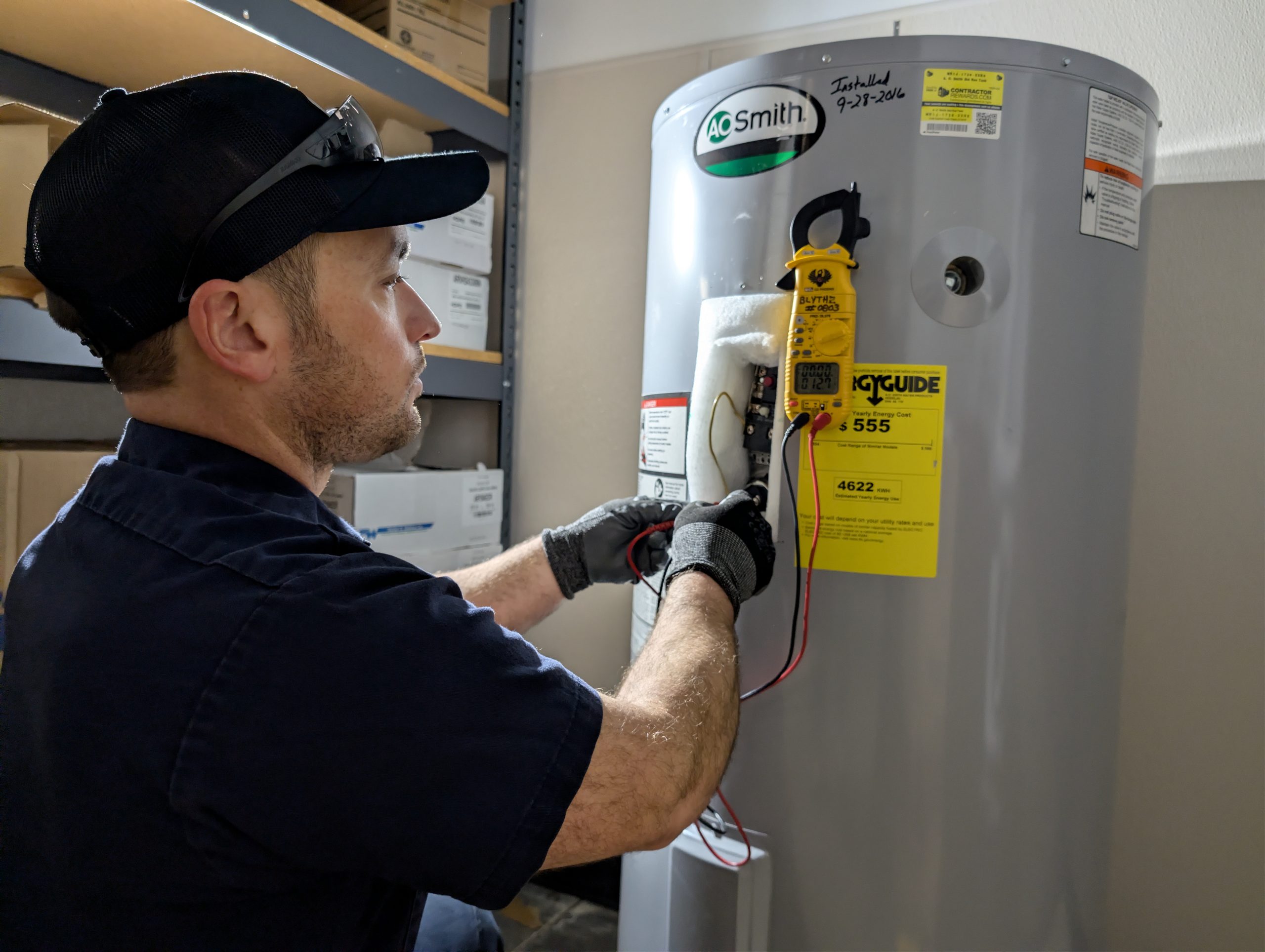 Technician performing preventative maintenance to support system performance, efficiency, and reliability.